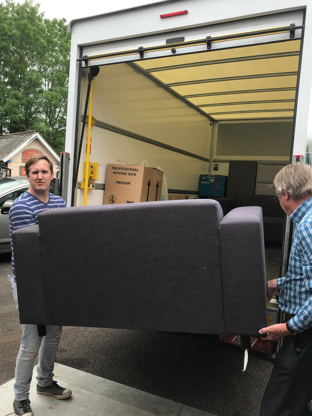Isaac and Steven Randall moving office furniture
