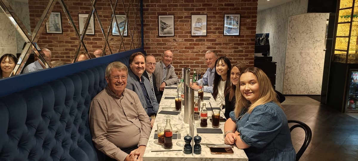 Team members enjoying a summer social event