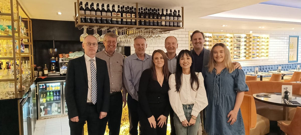 Team members enjoying a summer social event