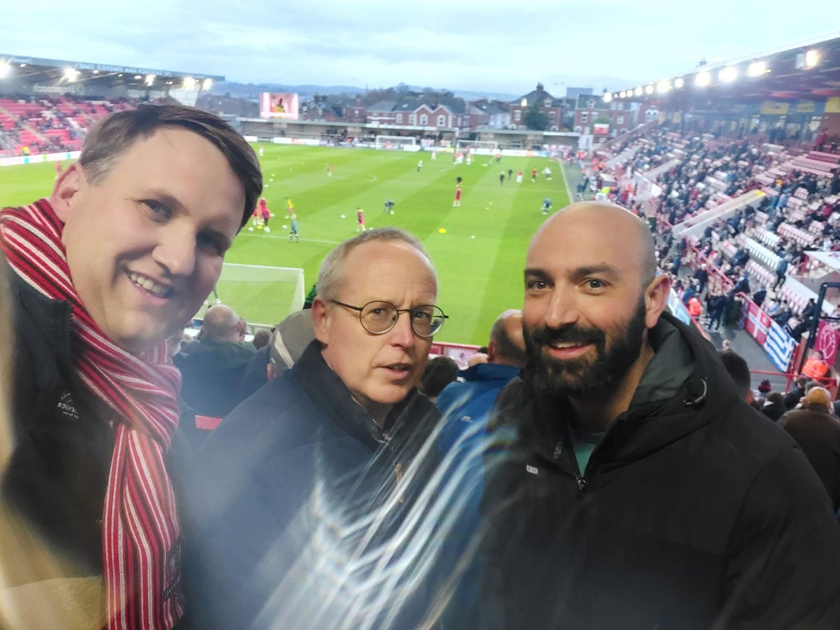 Colleagues together at a football match