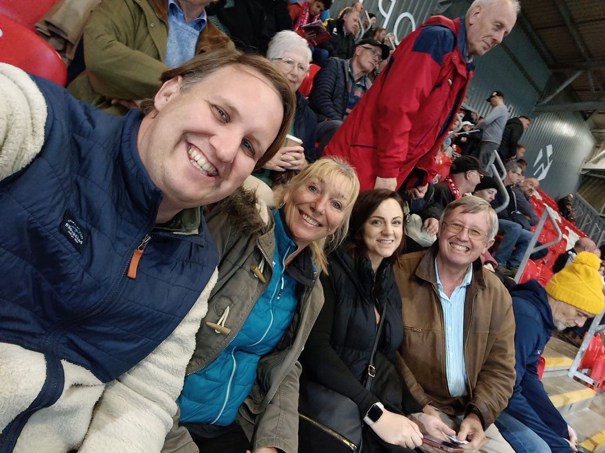 Family and colleagues together at a stadium